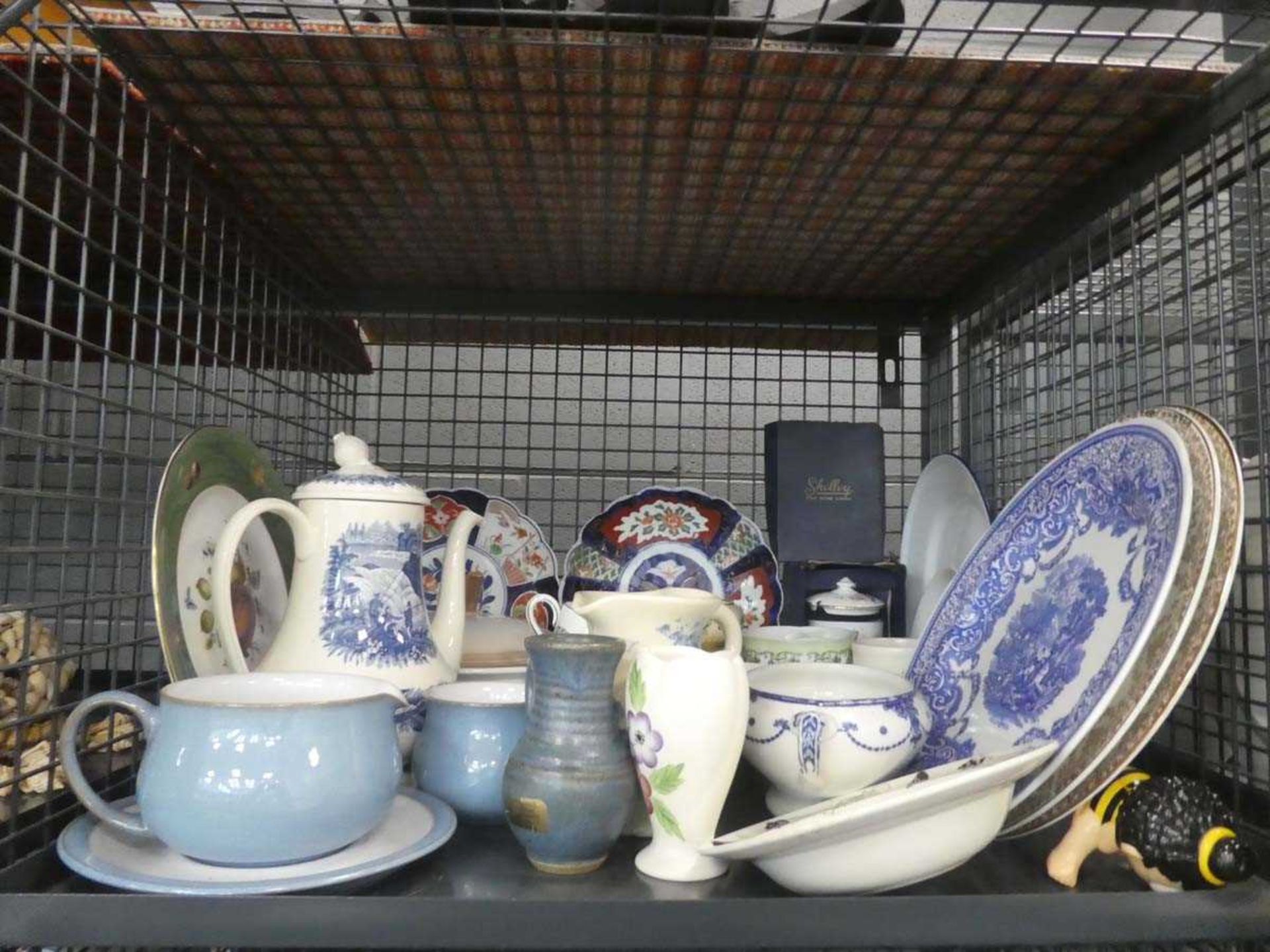 Cage containing assorted china, studio ware jugs, blue and white plates, Oriental decorated