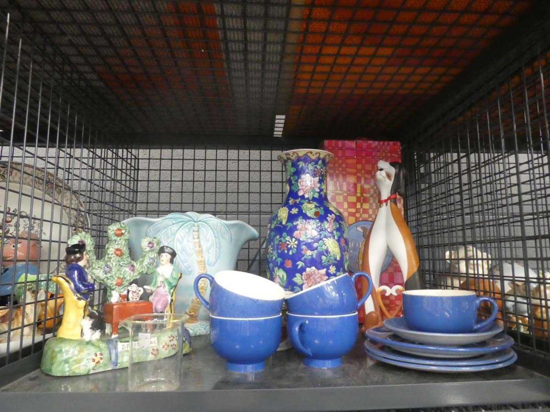 Cage containing blue and white coffee cups, saucers, palm decorated vase, Oriental vase, modern