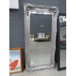 +VAT Large rectangular mirror with silver gilt frame