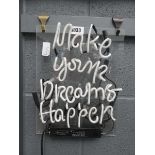 Neon sign "Make your dreams happen"