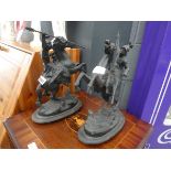 Two metal figures of warriors on horses