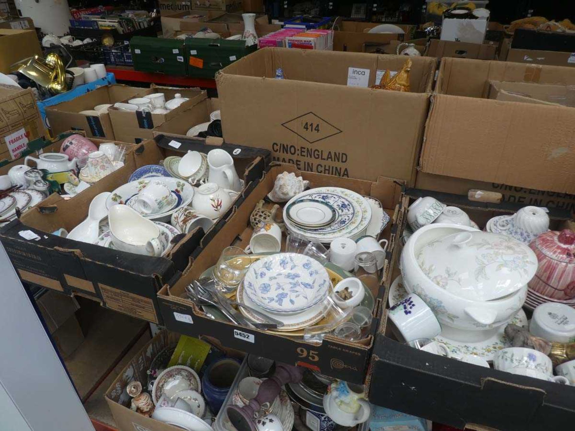 Four boxes of assorted china to include gravy boats, teacups, train figures, carved wooden