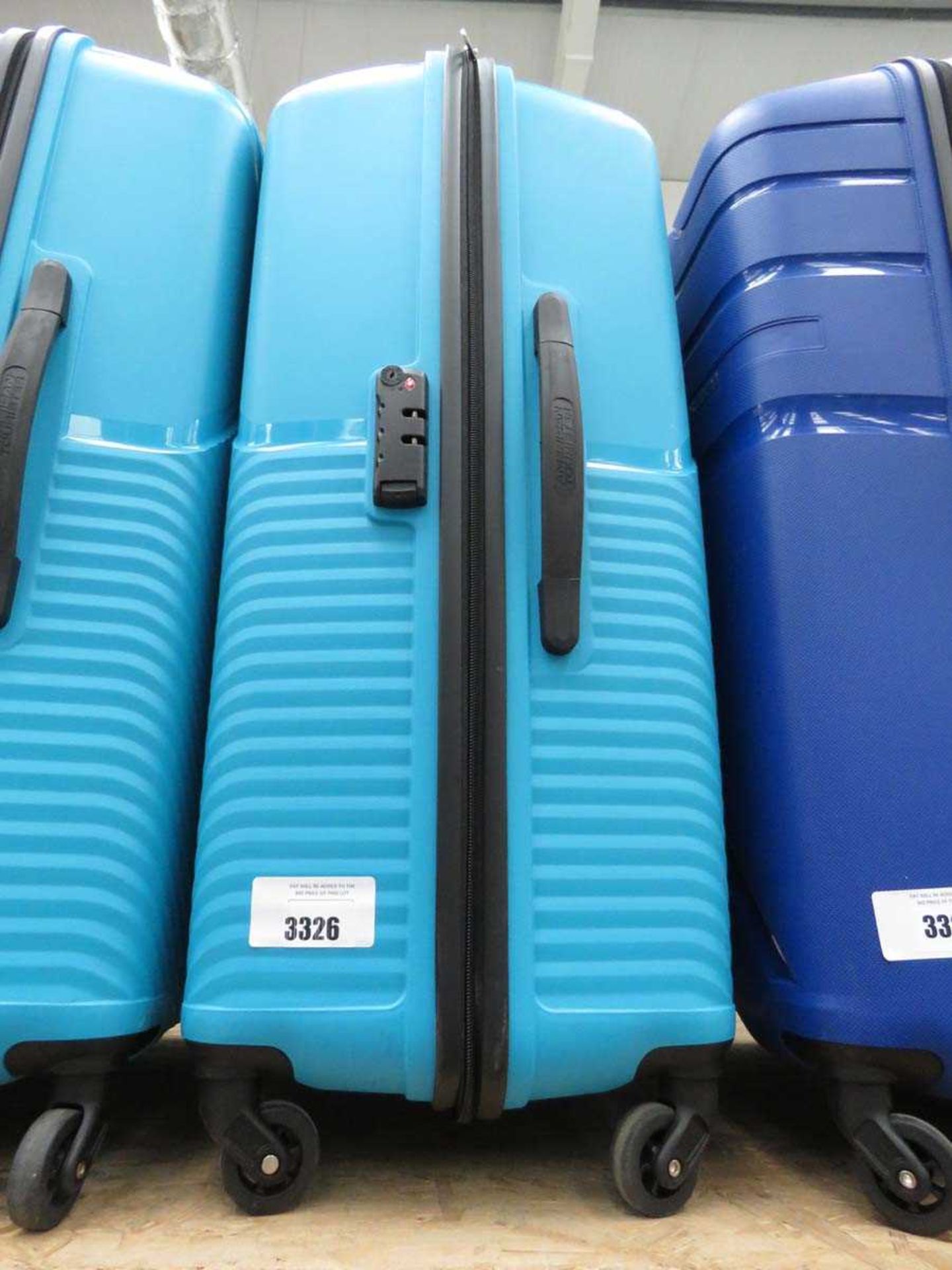 +VAT Large hard shelled American Tourister suitcase