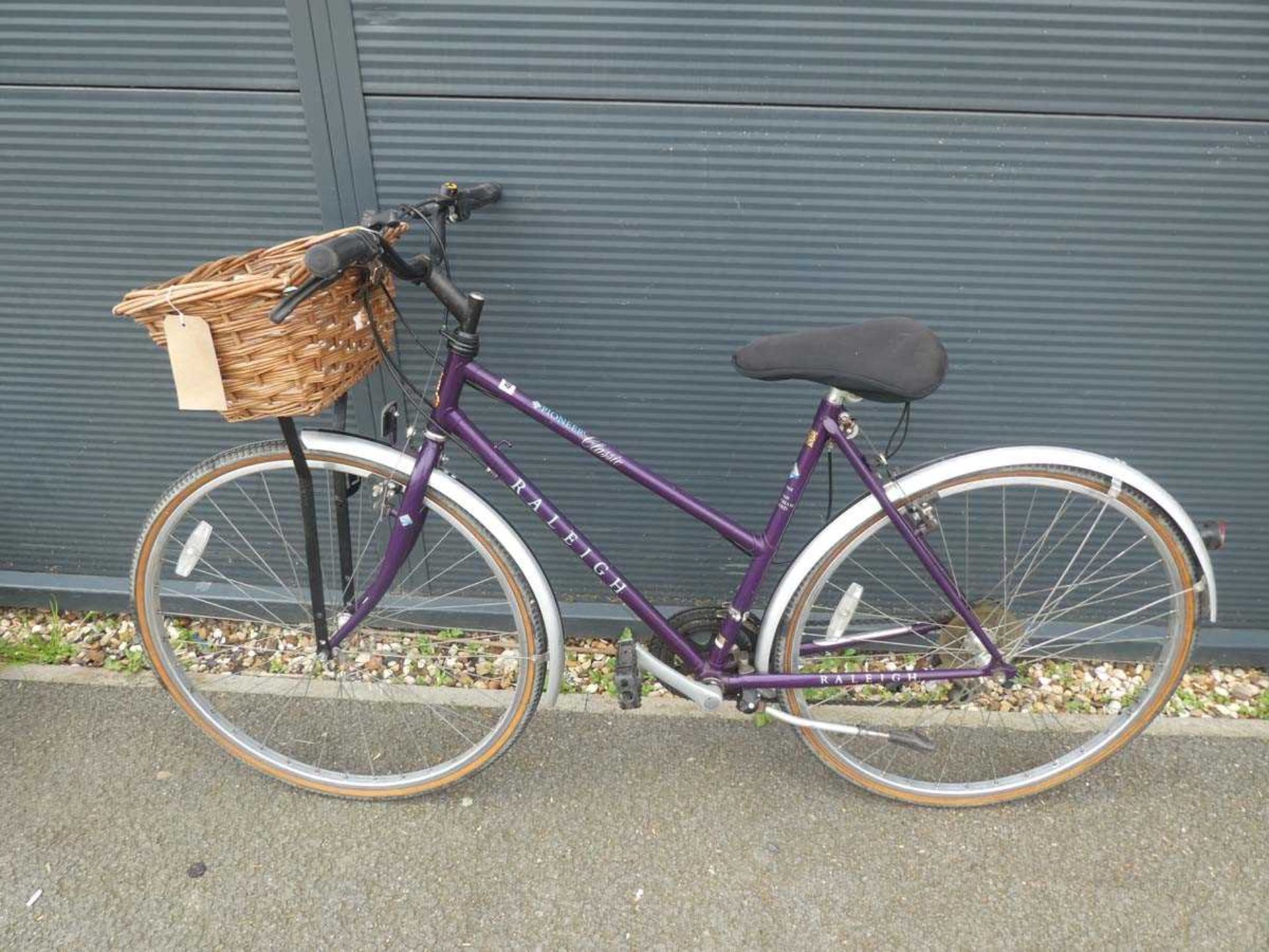 Purple Raleigh Pioneer ladies bike with front basket