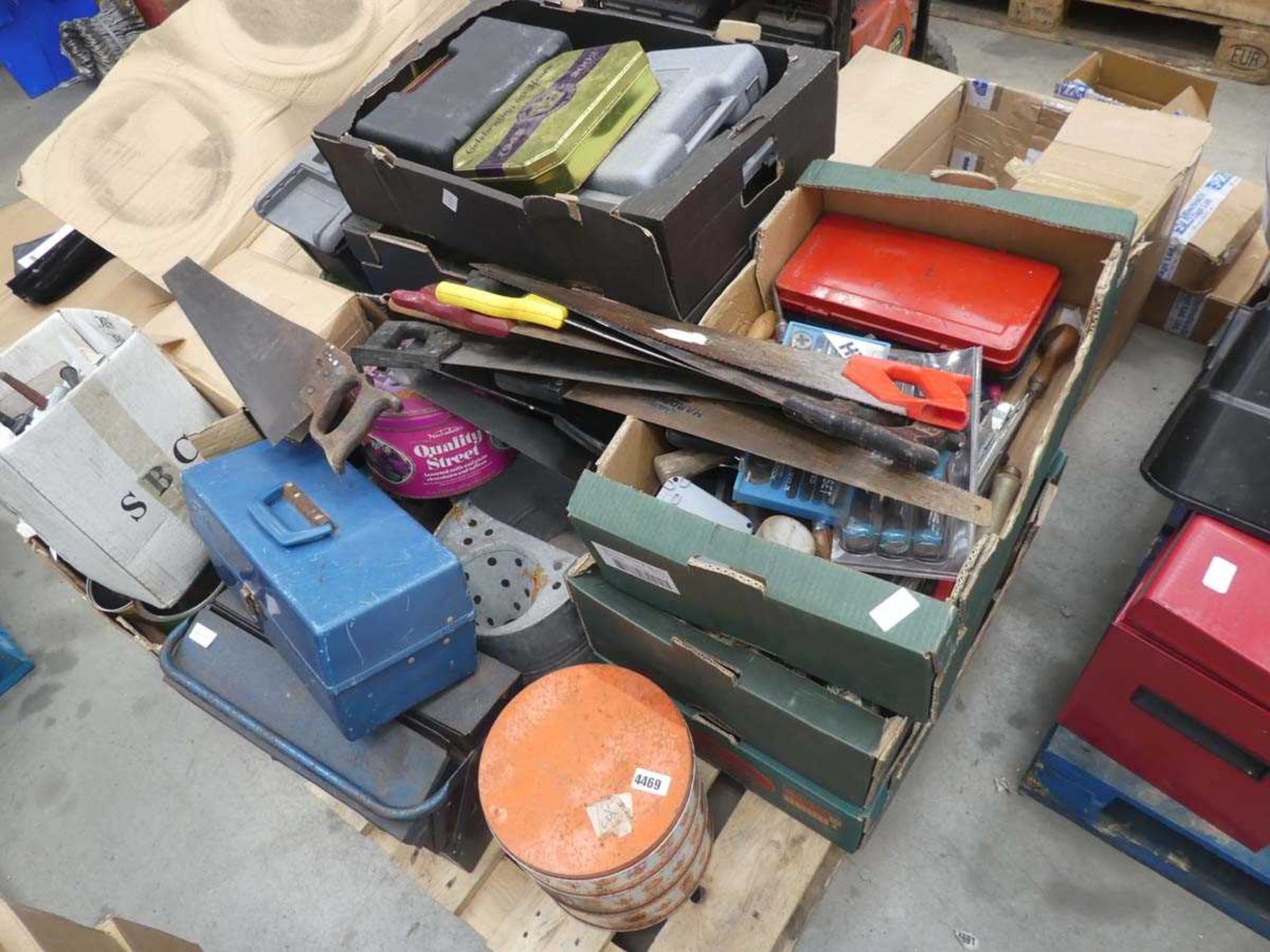 Large pallet of assorted items inc. saws, toolboxes, silicon, socket sets, chisels