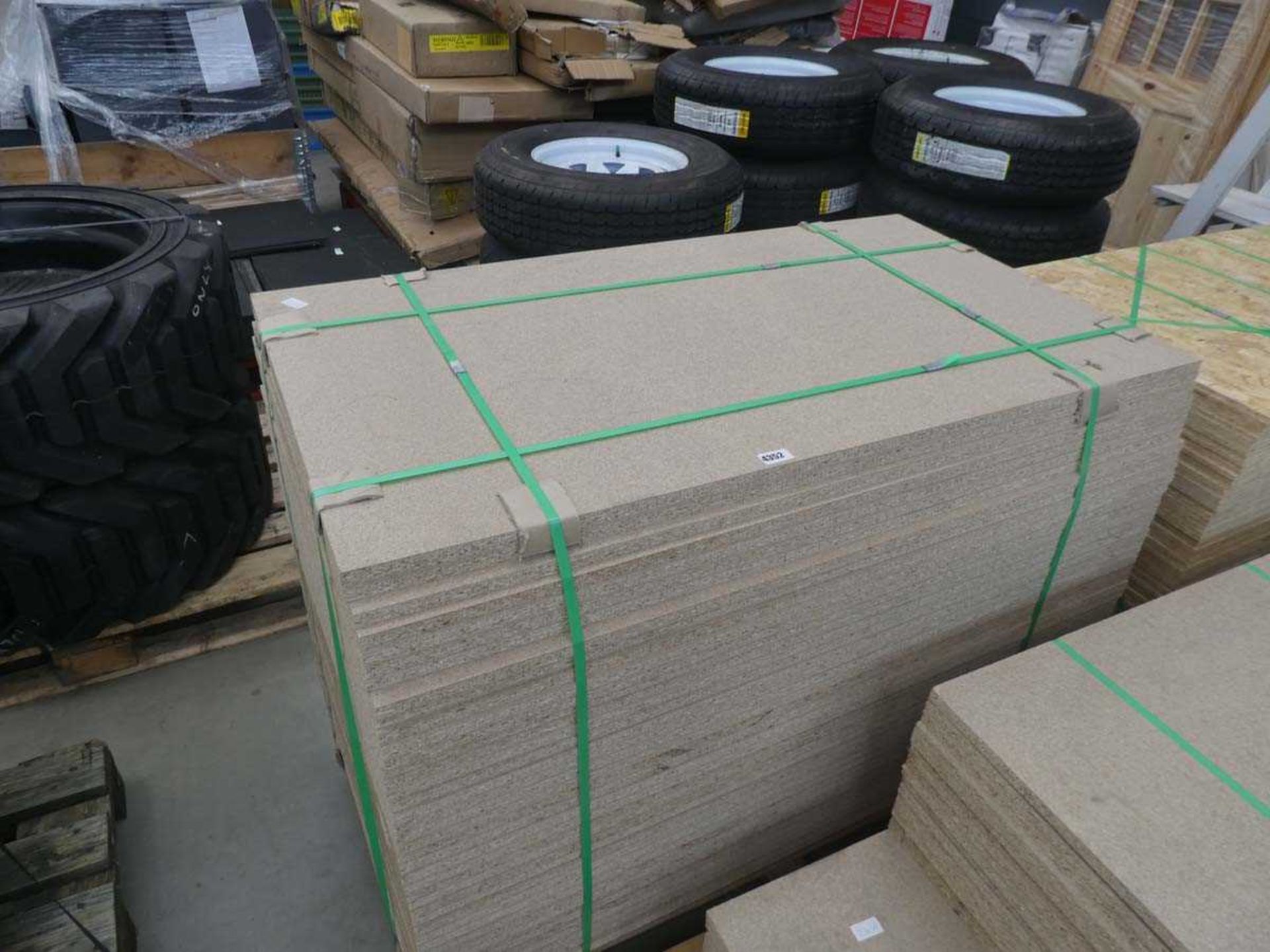 Large pallet of chipboard sheets