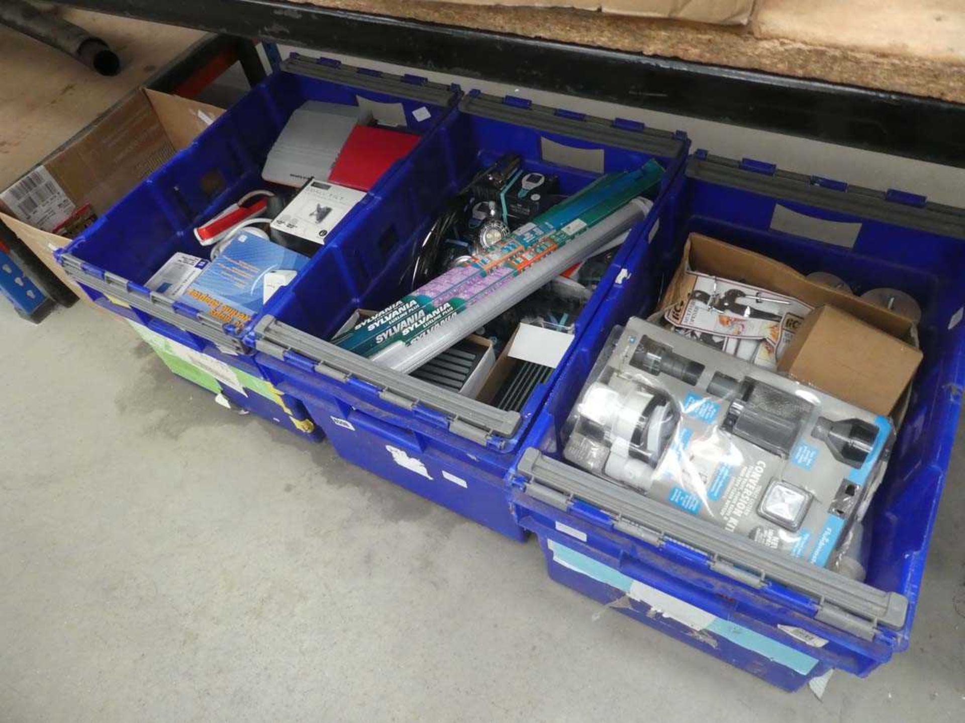 4 boxes of assorted items including bulbs, locks, lights, toilet conversion kits etc