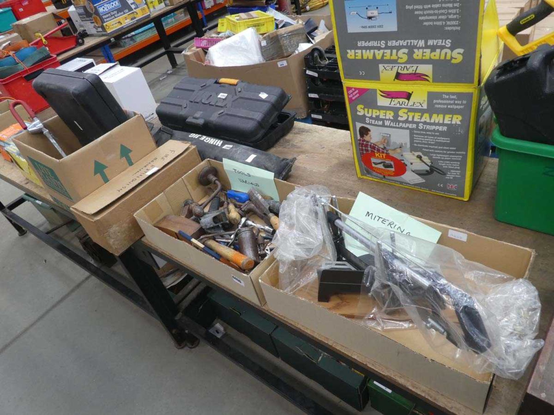 4 boxes containing various tools, fire extinguisher, car lock, mitre saw, battery charger,