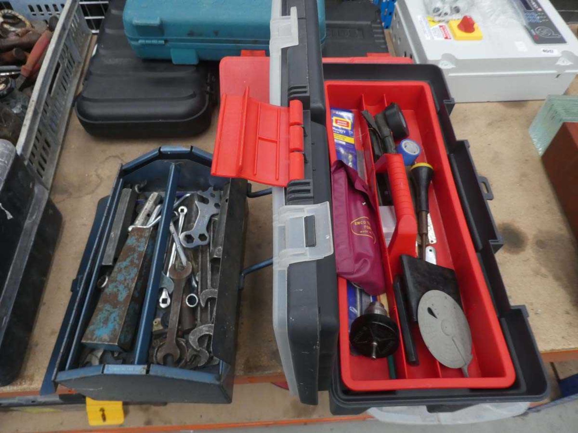 Blue cantilever toolbox containing spanners and a black plastic toolbox containing various