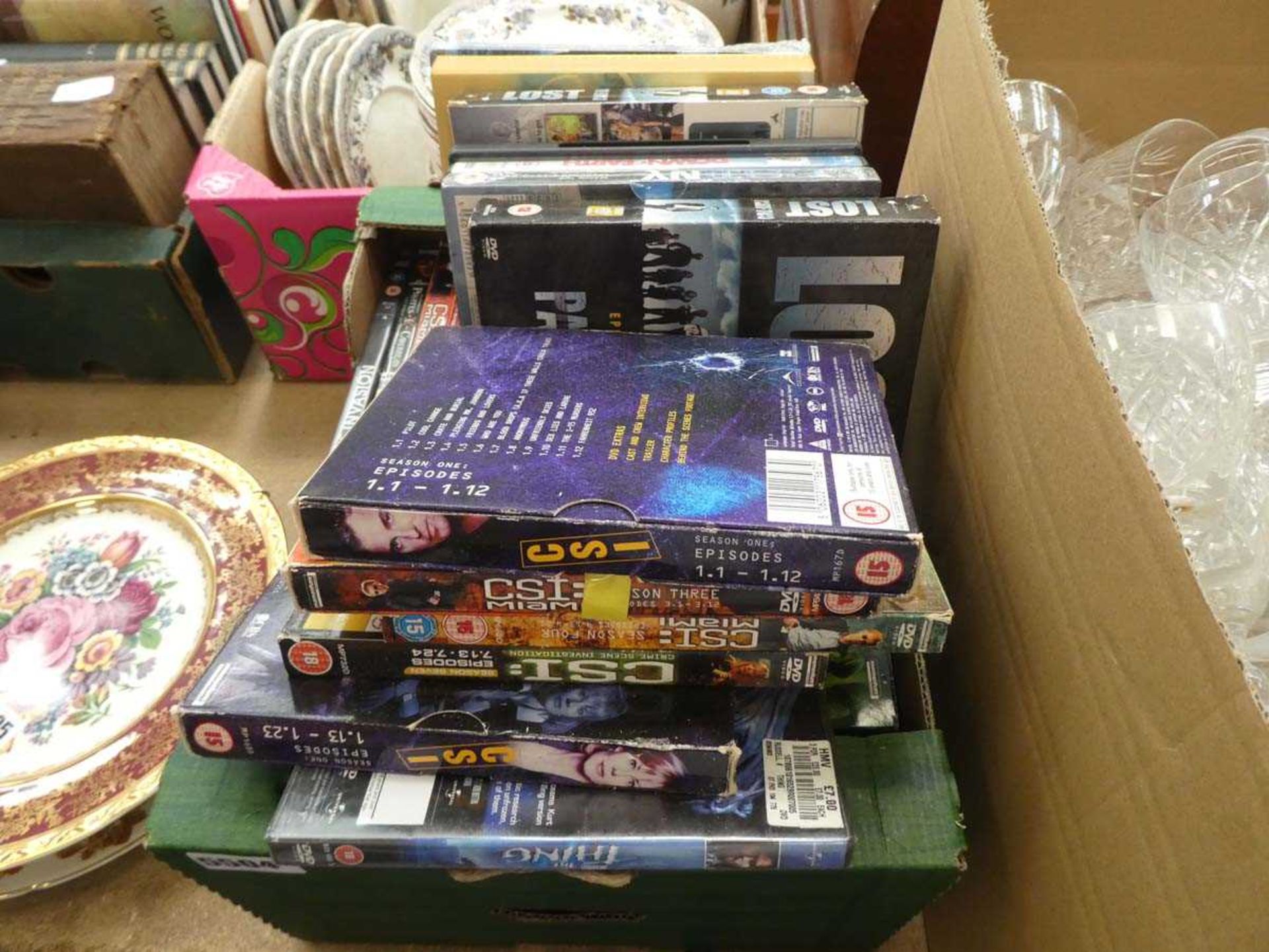 Box of DVDs to include Lost, Down to Earth, CSI etc