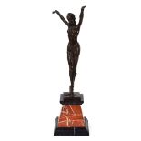After Demétre Chiparus, a bronze figure modelled as an Art Deco dancer, on a marble stepped