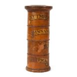 A late 19th century fruitwood four-section spice container of cylindrical form, h. 20 cm