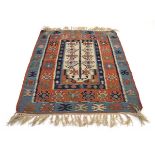 A Central Asian kilim decorated with fertility motifs around a central ground, 168 x 114 cm
