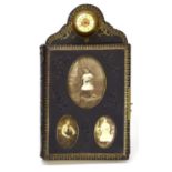 An Edwardian tooled leather photograph album surmounted by a miniature brass timepiece, the cover