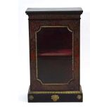 A 19th century pier cabinet, the black marble surface over a boulle work body with gilt metal