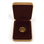 A Pobjoy Mint proof one crown coin commemorating the Queen Mother, cased