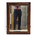 A Georgian walnut mirror, the bevelled glass plate within a cushioned frame, overall 74 x 53 cm