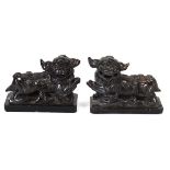 A pair of soapstone figures modelled as temple dogs, w. 13 cm each