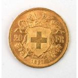 A Swiss 20 franc coin dated 1897