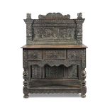 A 19th century carved oak sideboard in the 17th century manner, the superstructure frieze carved for