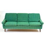 A 1960's Danish three-seater sofa by Skippers Mobler upholstered in green and blue fleck, on