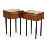 A pair of 1960/70's and later teak bedside tables, each with a glazed surface and single drawer,
