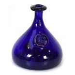 Ole Winther for Holmegaard, a blue glass decanted with a Viking head seal, h. 23 cm