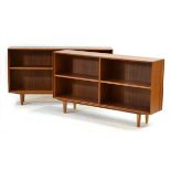 A pair of Danish teak open bookcases, on later circular legs, w. 134 cm eachPlease see the