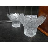 A pair of moulded glass flower-head vases decorated with stylised flowers, d. 14 cm each