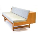 A Danish oak and upholstered sofabed by 'Hjorring Sofa System', the back lifting up to provide