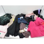 +VAT A bag containing Ladies Clothing in various sizes, including Champion, Fila