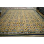 +VAT A 20th century carpet decorated in the Oriental manner with repeated motifs and geometric