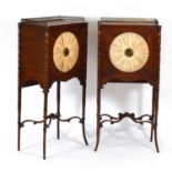 A pair of Regency rosewood and brass mounted pot cupboards, the doors with watered silk panels, on