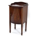 An Edwardian mahogany and marquetry bow-fronted pot cupboard on tapering legs with block feet, w. 40