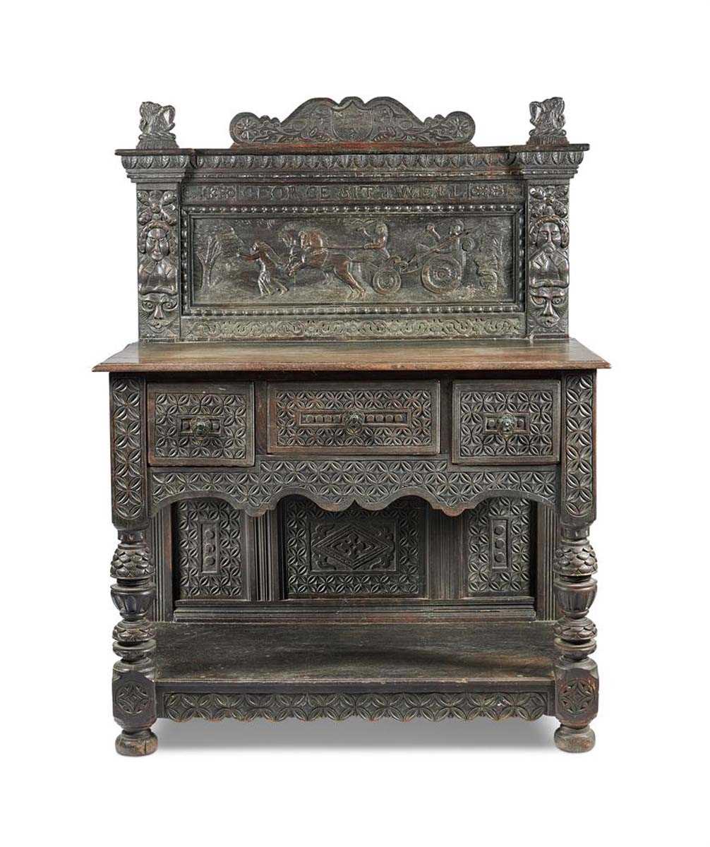A 19th century carved oak sideboard in the 17th century manner, the superstructure frieze carved for