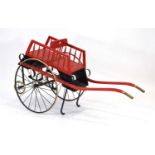 Shaw & Co. of Piccadilly, a 'goat cart' or 'mail cart' with four wheels, red body and enamelled