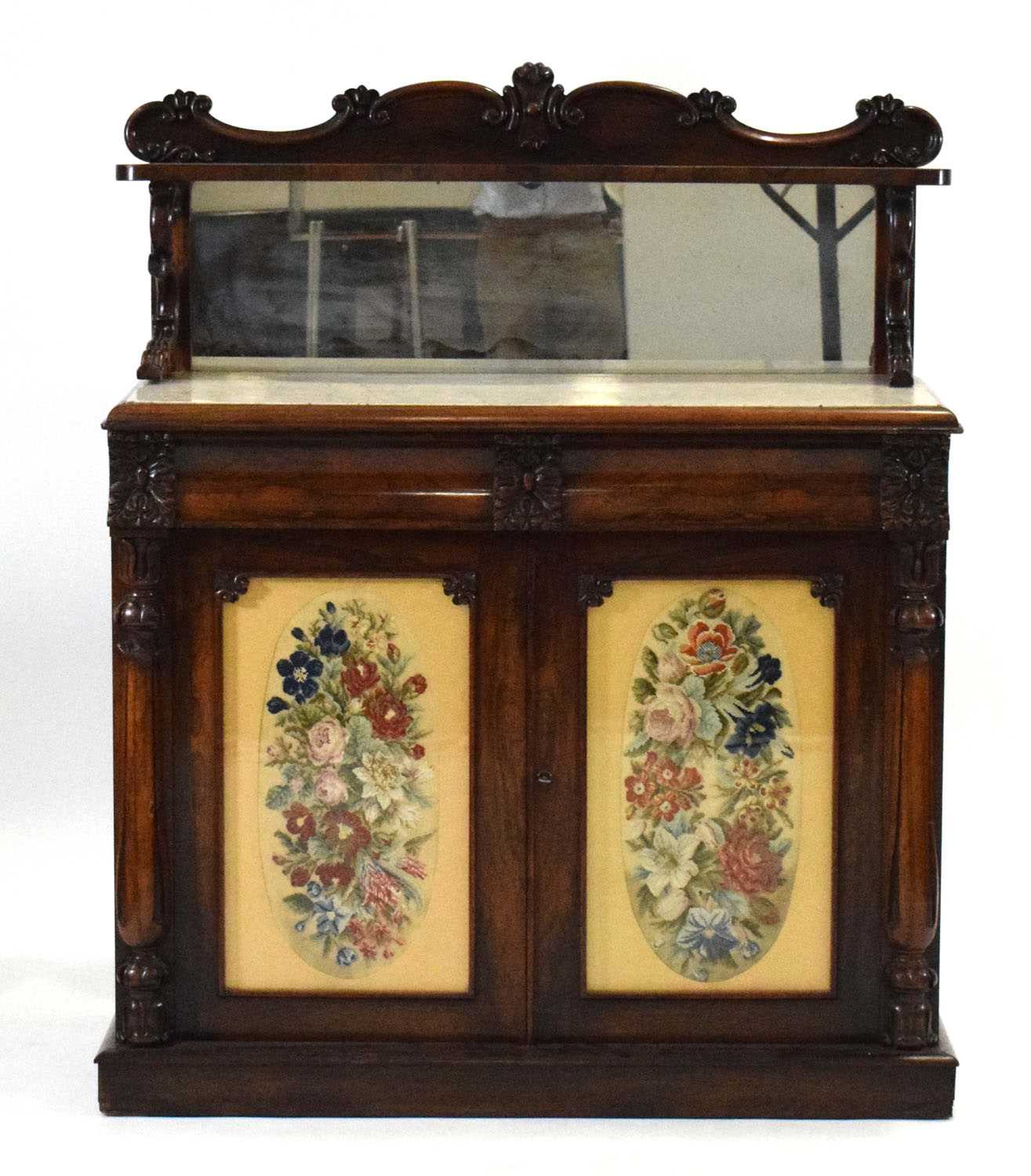An early 19th century rosewood chiffonier, the mirrored superstructure over a marble surface and