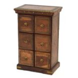 A modern hardwood and brass-bound cabinet with six drawers, h. 65 cm