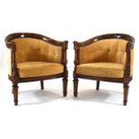 A pair of beech Marquis-style bergere tub armchairsReproduction. Structurally sound. Clean and tidy.