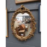 Mirror in ornate gilt frame