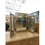 Three panelled dressing table mirror in decorative gilt frame