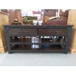 Dark wood entertainment unit with drawers and shelves under