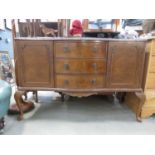 Reproduction walnut serpentine fronted sideboard