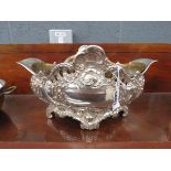A WMF silver plated table centre of flared oval form, decorated in the Rococo manner, w. 33 cm (af)
