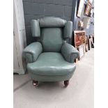 Blue leather effect wing back armchair