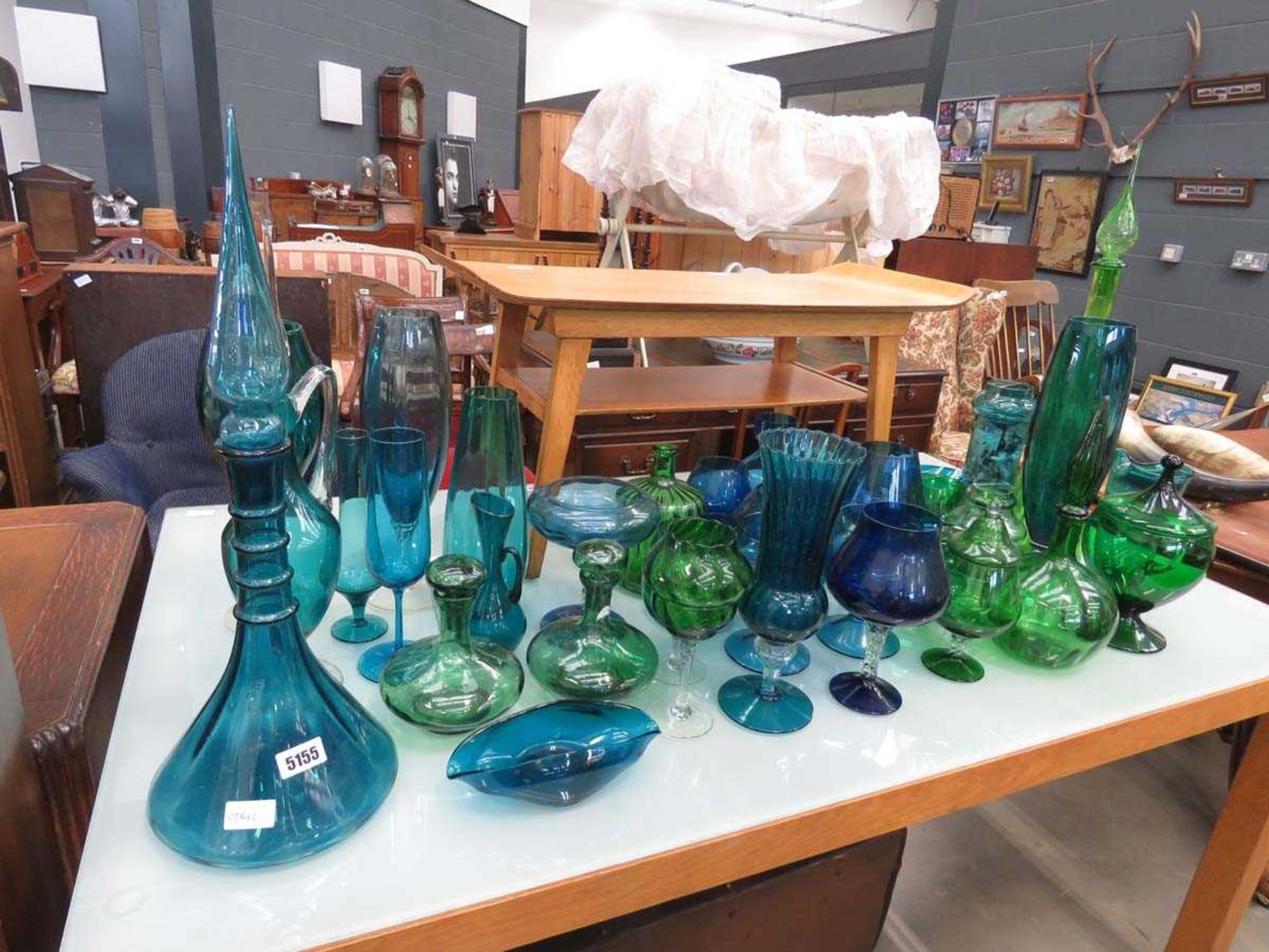 Collection of blue and green glass to include jugs, bowls and decanters