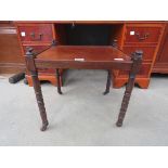 Mahogany side table with castors