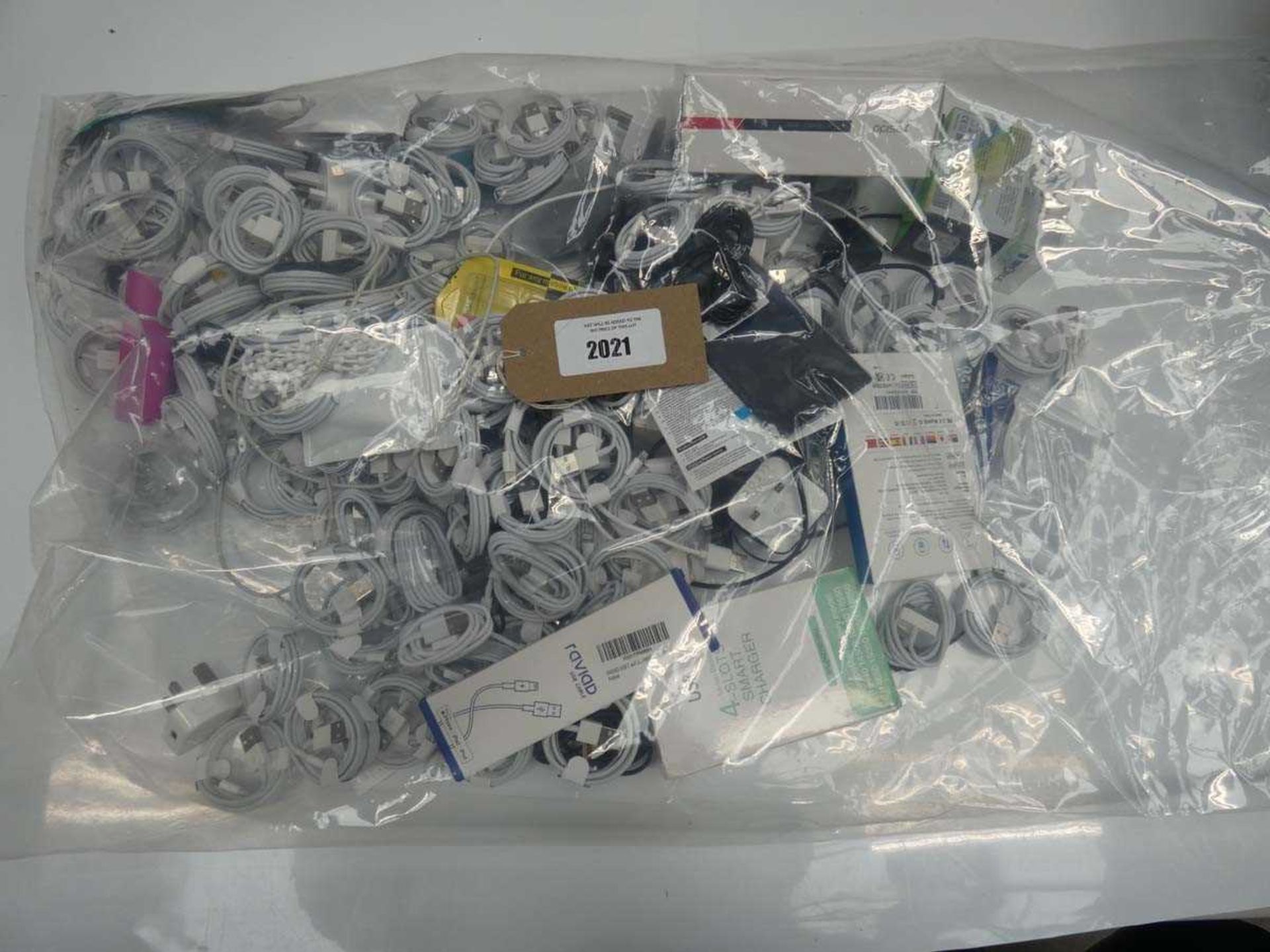 +VAT Bag containing quantity of mobile phone accessories; leads, adapters, cables, earphones,