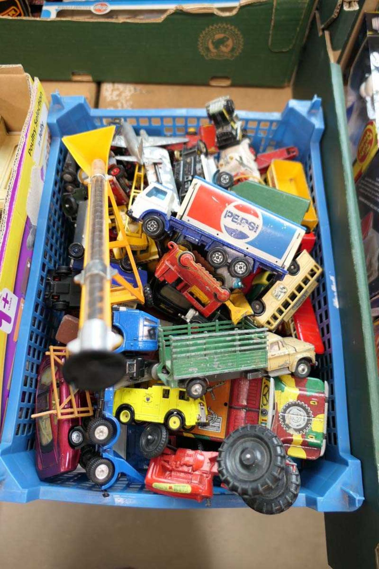 Tray containing various loose playworn die cast vehicles, some commercial