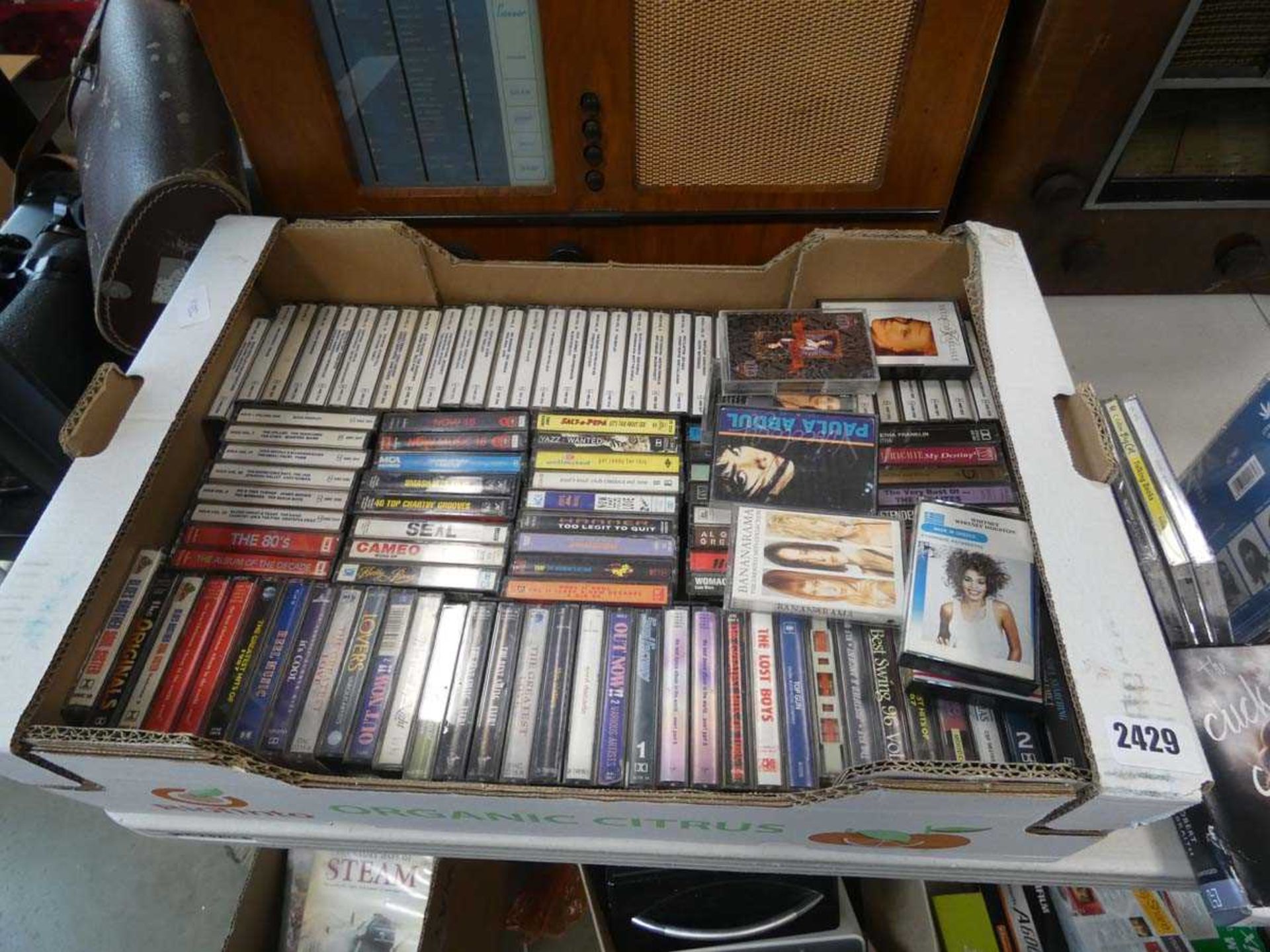 Tray containing a wide selection of cassette tapes by various artists